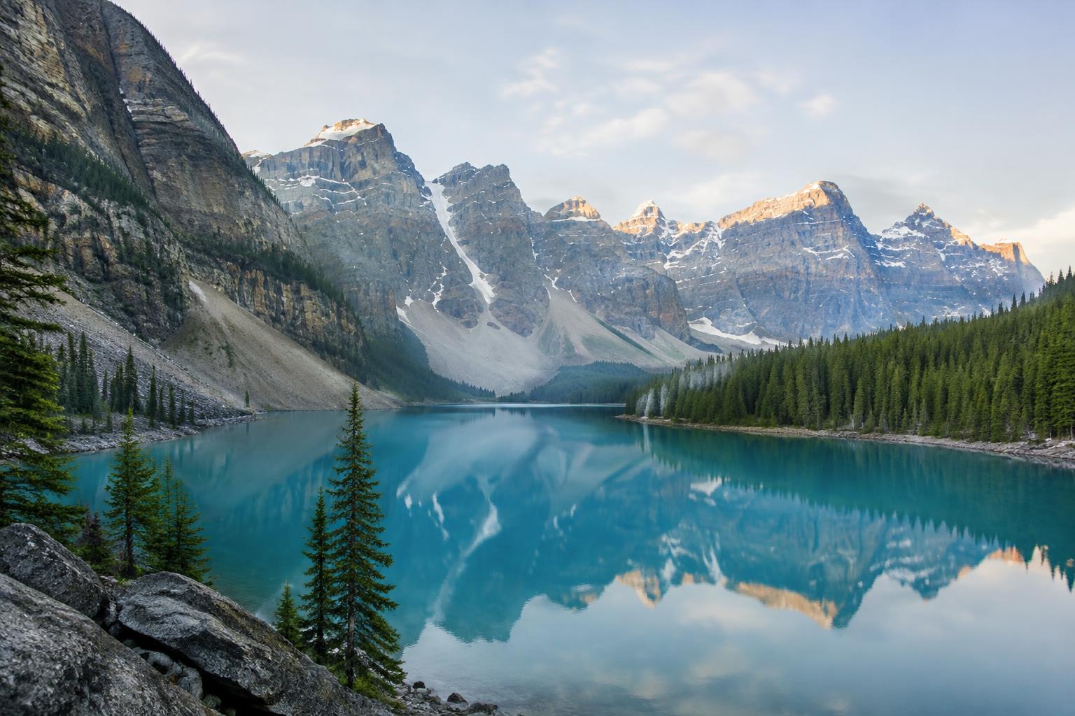 Turquoise glacial lake below snowy peaks in Banff National Park